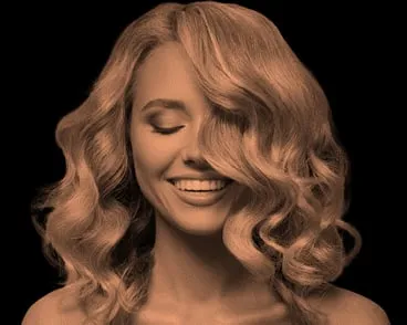 The blonde woman from the advert, smiling with her eyes closed